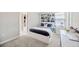Well-lit bedroom with a comfy bed, a desk area, and window views, creating a serene retreat at 1476 Fort Cobb Ter, Wesley Chapel, FL 33543