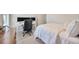 Well-lit bedroom with a desk, comfortable bed, and window view, providing a serene and functional retreat at 1476 Fort Cobb Ter, Wesley Chapel, FL 33543