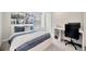Bedroom featuring a comfortable bed, desk, and window view, creating a relaxing and functional space at 1476 Fort Cobb Ter, Wesley Chapel, FL 33543