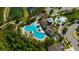 Aerial view of the community pool, splash pad, and surrounding amenities, perfect for Gathering fun at 1476 Fort Cobb Ter, Wesley Chapel, FL 33543