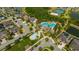 Stunning aerial view of the community pool and recreation area, surrounded by lush landscaping at 1476 Fort Cobb Ter, Wesley Chapel, FL 33543
