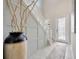 Bright entryway featuring a decorative vase, staircase, and tile flooring at 1476 Fort Cobb Ter, Wesley Chapel, FL 33543