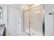 Modern tiled shower with glass doors at 1476 Fort Cobb Ter, Wesley Chapel, FL 33543