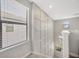Staircase with decorative wall trim and natural light at 1476 Fort Cobb Ter, Wesley Chapel, FL 33543