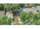 Aerial view of the property shows neighborhood layout and green spaces, along with screened in pool at 1524 Marsh Wood Dr, Seffner, FL 33584