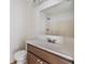 Bathroom featuring a large mirror, single sink vanity, and a shower with bright white tiles at 1524 Marsh Wood Dr, Seffner, FL 33584