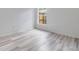 Bedroom with wood-look flooring and a large window at 1524 Marsh Wood Dr, Seffner, FL 33584