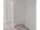Walk-in closet with modern wood-look flooring and a metal storage shelf at 1524 Marsh Wood Dr, Seffner, FL 33584