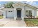 Charming single-Gathering home featuring an attached garage and inviting front entrance at 1524 Marsh Wood Dr, Seffner, FL 33584