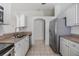 Traditional kitchen with stainless steel appliances, white cabinets and tiled flooring at 1524 Marsh Wood Dr, Seffner, FL 33584