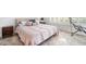 Comfortable bedroom with large bed, neutral color scheme and tile floors at 15707 Crystal Waters Dr, Wimauma, FL 33598