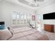 Serene bedroom with serene views, natural light and access to outdoors at 15707 Crystal Waters Dr, Wimauma, FL 33598