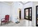 Inviting foyer with high ceilings, tile flooring, and stylish decor creating a grand entrance at 15707 Crystal Waters Dr, Wimauma, FL 33598