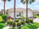 Charming home exterior with well-manicured landscaping and a paver driveway at 15707 Crystal Waters Dr, Wimauma, FL 33598
