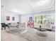 Bright living room with large windows, plantation shutters, recessed lights, and elegant decor at 15707 Crystal Waters Dr, Wimauma, FL 33598