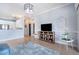 Stylish living room with neutral tones, tiled floors and modern decor at 15707 Crystal Waters Dr, Wimauma, FL 33598