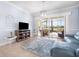 Open living room with sliding glass doors leading to outdoor patio and backyard at 15707 Crystal Waters Dr, Wimauma, FL 33598