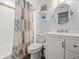 Bathroom featuring patterned shower curtain and a white vanity at 16116 Manorwood Cir, Tampa, FL 33624