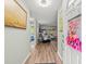 Inviting entryway featuring hardwood floors and a glimpse into the living area at 16116 Manorwood Cir, Tampa, FL 33624