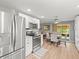 Kitchen with stainless steel appliances that opens up to a cozy dining area at 16116 Manorwood Cir, Tampa, FL 33624