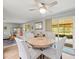 Open-concept living room with sliding doors leading to a screened in patio at 16116 Manorwood Cir, Tampa, FL 33624