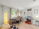 Bright home office with a desk, keyboard and ample natural light at 16116 Manorwood Cir, Tampa, FL 33624