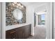 Stylish bathroom with a decorative backsplash, modern vanity, and adjacent bedroom view at 19816 Gulf Blvd # 602, Indian Shores, FL 33785