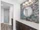 Modern bathroom featuring a stylish vanity with a mosaic tile backsplash and a glass-enclosed shower at 19816 Gulf Blvd # 602, Indian Shores, FL 33785
