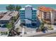 Stunning beachfront building with sleek architecture, lush landscaping, and ocean views at 19816 Gulf Blvd # 602, Indian Shores, FL 33785