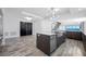 A large kitchen island is the central feature with an undermount sink and modern plumbing fixtures at 19816 Gulf Blvd # 602, Indian Shores, FL 33785