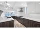 Bright modern kitchen featuring stone countertops and views of the ocean at 19816 Gulf Blvd # 602, Indian Shores, FL 33785