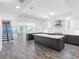 This open-concept kitchen boasts sleek cabinetry, modern appliances, and an island with seating at 19816 Gulf Blvd # 602, Indian Shores, FL 33785