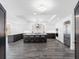 Expansive kitchen with a central island, stylish pendant lighting, and modern stainless steel appliances at 19816 Gulf Blvd # 602, Indian Shores, FL 33785