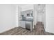Modern kitchenette featuring light grey cabinets, a microwave, and stainless steel appliances at 19816 Gulf Blvd # 602, Indian Shores, FL 33785