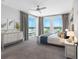 Bright main bedroom featuring a ceiling fan, neutral tones, and water views at 19816 Gulf Blvd # 602, Indian Shores, FL 33785