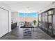 Office with wood floors, custom shelving, water view, and modern lighting at 19816 Gulf Blvd # 602, Indian Shores, FL 33785