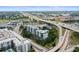 An aerial view of the condominium complex with waterfront access and city skyline at 201 W Laurel St # 307, Tampa, FL 33602