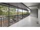Spacious screened balcony with black metal railings overlooking the parking lot at 201 W Laurel St # 307, Tampa, FL 33602