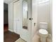 Bathroom featuring a white toilet, vanity mirror, and closet for storage at 201 W Laurel St # 307, Tampa, FL 33602