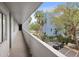 Exterior shot of the condominium complex walkway with landscaping and palm trees in the background at 201 W Laurel St # 307, Tampa, FL 33602