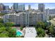 Exterior shows the building, palm trees and the pool for the community at 201 W Laurel St # 307, Tampa, FL 33602