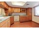 Kitchen featuring tile floors and wood cabinets at 201 W Laurel St # 307, Tampa, FL 33602