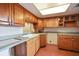 The kitchen features wood cabinets, and a tile floor at 201 W Laurel St # 307, Tampa, FL 33602