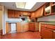 Kitchen featuring tile floor, wood cabinets and neutral walls at 201 W Laurel St # 307, Tampa, FL 33602