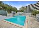 Community pool with clear blue water and surrounding lounging area, perfect for relaxation and recreation at 201 W Laurel St # 307, Tampa, FL 33602