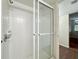 Modern bathroom shower featuring clear glass doors and tiled walls at 201 W Laurel St # 307, Tampa, FL 33602