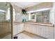Elegant bathroom with a large mirror, granite countertops, and a glass-enclosed shower for a luxurious feel at 209 Arlington E Ave, Oldsmar, FL 34677