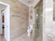 Bathroom featuring decorative wall tile, a glass shower, and modern fixtures for a spa-like retreat at 209 Arlington E Ave, Oldsmar, FL 34677