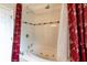 Bright bathroom featuring a large bathtub with massaging jets and a tiled surround at 209 Arlington E Ave, Oldsmar, FL 34677