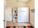 Bright bedroom with a Murphy bed, built in shelves, and light wood flooring at 209 Arlington E Ave, Oldsmar, FL 34677
